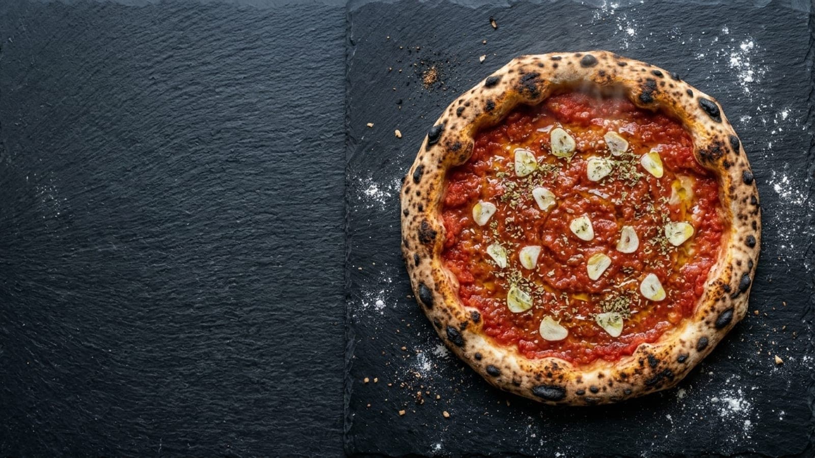 Marinara pizza, overhead — crushed tomatoes, garlic, dried oregano, extra-virgin olive oil