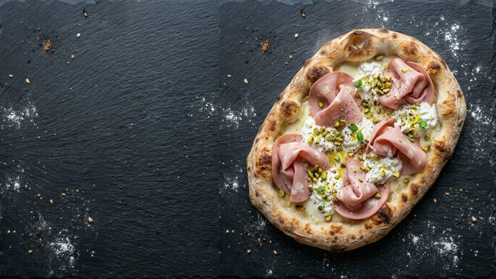 Pinsa mortadella e stracciatella pizza, overhead — fresh mozzarella