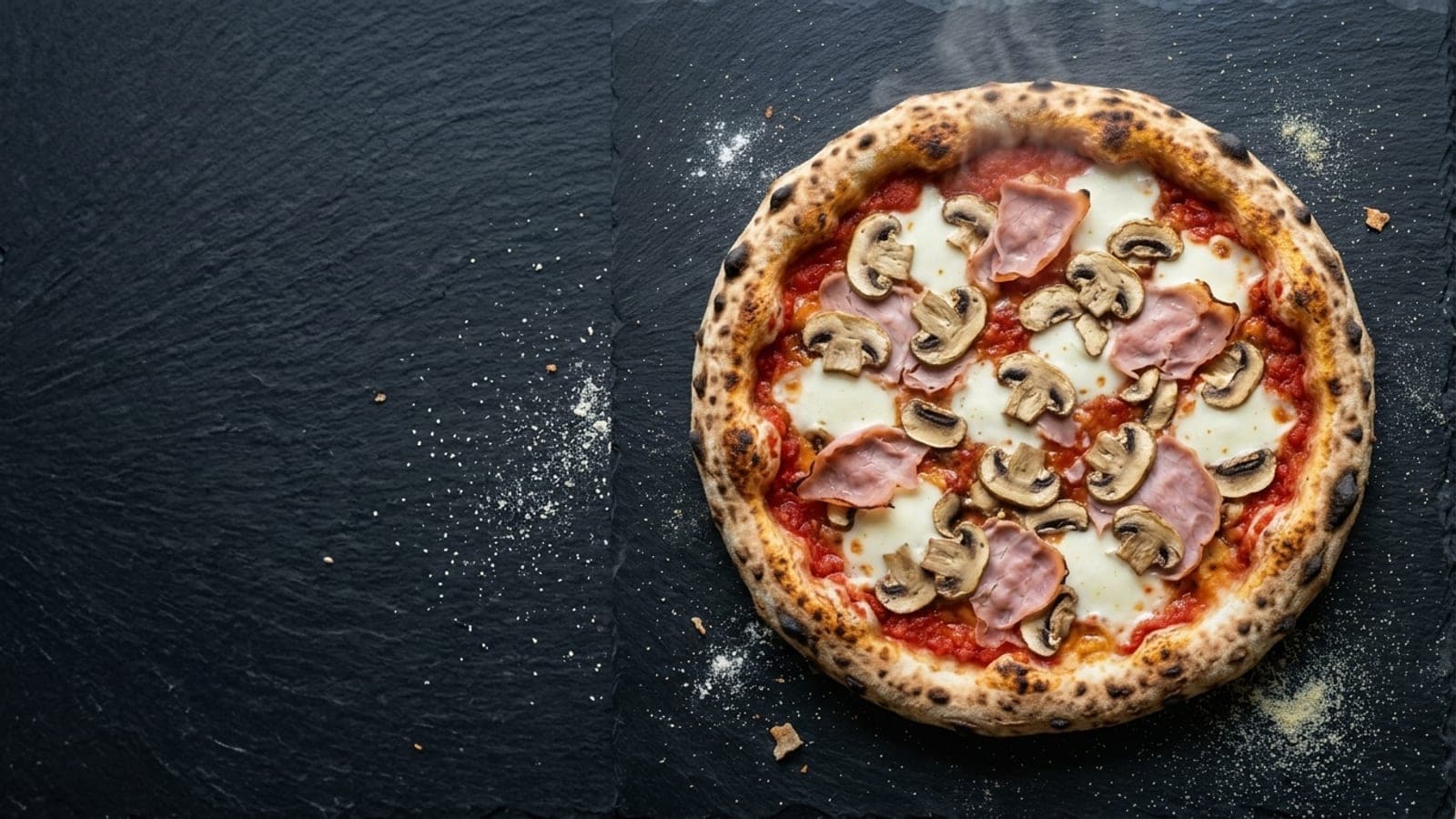 Prosciutto e funghi pizza, overhead — crushed tomatoes, fresh mozzarella, mushrooms, cooked ham