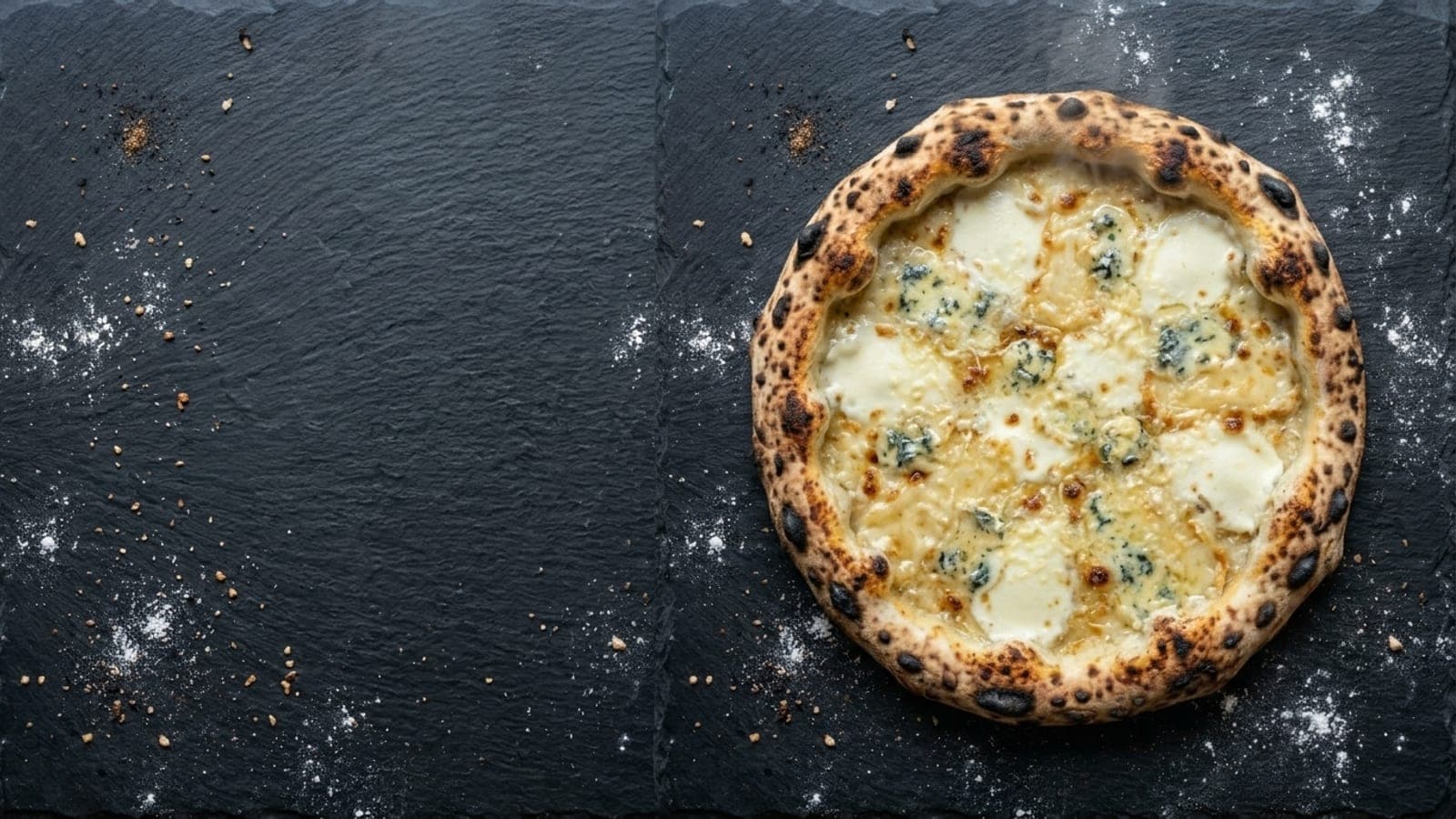Quattro formaggi pizza, overhead — fresh mozzarella, gorgonzola, fontina, parmigiano reggiano